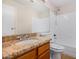 Bathroom featuring granite countertops, a sink, and a shower-tub combination at 3416 W Julie Dr # 4, Phoenix, AZ 85027