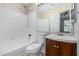 Bright bathroom with a shower-tub combination and a wood vanity sink at 3416 W Julie Dr # 4, Phoenix, AZ 85027