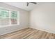 Bedroom featuring a large window and wood-look flooring at 3416 W Julie Dr # 4, Phoenix, AZ 85027
