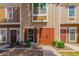 A straight-on shot of four townhomes showing the front doors and front windows of each home at 3416 W Julie Dr # 4, Phoenix, AZ 85027