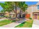 Exterior view of townhomes with individual sidewalks and front yards showcasing curb appeal at 3416 W Julie Dr # 4, Phoenix, AZ 85027