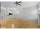 Open-concept living room with tile flooring and a view into the kitchen at 3416 W Julie Dr # 4, Phoenix, AZ 85027
