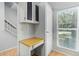 Built-in desk and cabinets for an office nook near a naturally lit window at 3416 W Julie Dr # 4, Phoenix, AZ 85027