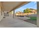 Large covered patio overlooking backyard with pool and rock waterfall feature at 3535 W Morgan Ln, San Tan Valley, AZ 85144