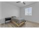 Bedroom with a twin bed, simple nightstand and wood-look flooring at 3535 W Morgan Ln, San Tan Valley, AZ 85144
