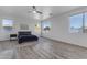Large bedroom with natural light, ceiling fan, and views of the neighborhood at 3535 W Morgan Ln, San Tan Valley, AZ 85144
