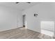 Bright bedroom with door, TV mount, and neutral hard surface floors at 3535 W Morgan Ln, San Tan Valley, AZ 85144