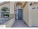 Front door entry with brick paved walkway and architectural details on the house's facade at 3535 W Morgan Ln, San Tan Valley, AZ 85144