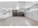 Spacious garage is clean, bright and includes large cabinets on the wall at 3535 W Morgan Ln, San Tan Valley, AZ 85144