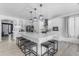 Bright kitchen with a large island, breakfast bar, and modern pendant lighting at 3535 W Morgan Ln, San Tan Valley, AZ 85144