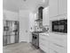 Modern kitchen featuring stainless steel appliances, sleek white cabinetry, and a gas range at 3535 W Morgan Ln, San Tan Valley, AZ 85144