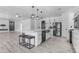 Spacious kitchen with a central island, barstool seating, and stainless steel appliances at 3535 W Morgan Ln, San Tan Valley, AZ 85144