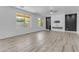 Spacious living room featuring large windows, contemporary fireplace, and sleek accent wall at 3535 W Morgan Ln, San Tan Valley, AZ 85144