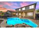 Backyard covered patio featuring a rock-lined pool, perfect for outdoor relaxation and entertaining at 3535 W Morgan Ln, San Tan Valley, AZ 85144