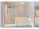 Bathroom featuring a shower, soaking tub, and black and white tiled floors at 3555 E Morenci Rd, San Tan Valley, AZ 85143