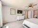Spacious bedroom featuring a ceiling fan and white dresser with decorative artwork at 3555 E Morenci Rd, San Tan Valley, AZ 85143