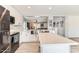 Modern kitchen featuring white cabinets, stainless steel appliances, and quartz countertops at 3555 E Morenci Rd, San Tan Valley, AZ 85143