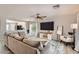 Bright living room with a large sectional sofa and an open view to the kitchen at 3555 E Morenci Rd, San Tan Valley, AZ 85143