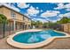 Inviting pool with safety fence, surrounded by a patio, in a well-maintained backyard at 3555 E Morenci Rd, San Tan Valley, AZ 85143