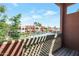 Balcony view of the community pool with various lounge chairs on a clear sunny day at 3600 N Hayden Rd # 3002, Scottsdale, AZ 85251