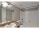 Bathroom featuring a combination shower and tub with a sink with brown cabinets and stone counters at 3600 N Hayden Rd # 3002, Scottsdale, AZ 85251