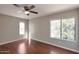Bedroom featuring wood floors and two windows providing natural light at 3600 N Hayden Rd # 3002, Scottsdale, AZ 85251