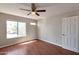 Bedroom featuring wood floors, window and neutral paint at 3600 N Hayden Rd # 3002, Scottsdale, AZ 85251
