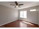 Bedroom featuring wood floors, large window, and neutral paint at 3600 N Hayden Rd # 3002, Scottsdale, AZ 85251