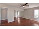 Bedroom featuring wood floors and mirrored closet at 3600 N Hayden Rd # 3002, Scottsdale, AZ 85251