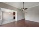 Open floor plan living room and dining area featuring wood and tile flooring at 3600 N Hayden Rd # 3002, Scottsdale, AZ 85251