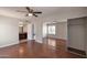 Spacious main bedroom featuring wood floors, a ceiling fan and a sliding door mirrored wardrobe at 3600 N Hayden Rd # 3002, Scottsdale, AZ 85251