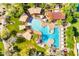 Aerial view showcasing the resort-style community pool with cabanas and lounge areas surrounded by lush landscaping at 3641 E Los Gatos Dr, Phoenix, AZ 85050