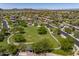 Expansive community view featuring neighborhood homes, a park, and scenic mountain views in the distance at 3641 E Los Gatos Dr, Phoenix, AZ 85050