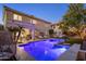 Stunning backyard showcases a luxurious pool and spa, ideal for enjoying warm evenings and outdoor entertainment at 3641 E Los Gatos Dr, Phoenix, AZ 85050