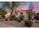 Beautiful desert home showcases desert landscaping, tile roof, and sunset at 3641 E Los Gatos Dr, Phoenix, AZ 85050