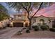 Stunning home features a three car garage, tile roof and desert landscaping at 3641 E Los Gatos Dr, Phoenix, AZ 85050
