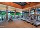 Well-equipped fitness center with treadmills, weights, and plenty of natural light from the large windows at 3641 E Los Gatos Dr, Phoenix, AZ 85050
