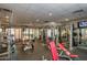 Functional fitness center with weight machines, free weights and TV for entertainment during workouts at 3641 E Los Gatos Dr, Phoenix, AZ 85050