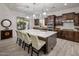 Gourmet kitchen with pendant lighting, a large island with seating, and stainless steel appliances at 3641 E Los Gatos Dr, Phoenix, AZ 85050