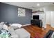 Comfortable living room with gray walls, hardwood floors, and modern decor at 3641 E Los Gatos Dr, Phoenix, AZ 85050