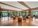 Expansive lobby with comfortable seating, fireplace, and large windows offering picturesque outdoor views at 3641 E Los Gatos Dr, Phoenix, AZ 85050