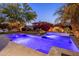 Lush backyard with a private pool, spa, and colorful desert landscaping at 3641 E Los Gatos Dr, Phoenix, AZ 85050