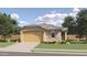Charming single-story home featuring a stone-accented facade and a two-car garage at 36525 W Maddaloni Ave, Maricopa, AZ 85138