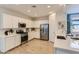 Modern kitchen with white cabinets, stainless steel appliances, and a spacious countertop at 36525 W Maddaloni Ave, Maricopa, AZ 85138