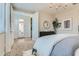 Serene main bedroom featuring soft lighting and doorway to the main bathroom at 36525 W Maddaloni Ave, Maricopa, AZ 85138