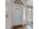 Interior view of the front door with decorative window, neutral paint, and tile flooring at 3711 E Long Lake Rd, Phoenix, AZ 85048