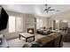 Cozy living room with a fireplace, ceiling fan, carpeting and comfortable seating at 3711 E Long Lake Rd, Phoenix, AZ 85048