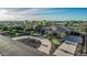 Spacious home featuring circular driveway, mature trees, desert landscaping and well-manicured lawn at 3754 E Flintlock Dr, Queen Creek, AZ 85142