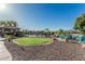 Beautiful backyard oasis with a rock garden, inviting gazebo, and ample seating for outdoor entertaining at 3754 E Flintlock Dr, Queen Creek, AZ 85142