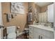 Elegant bathroom featuring a white vanity, decorative accents, and warm, inviting lighting creating a cozy ambiance at 3754 E Flintlock Dr, Queen Creek, AZ 85142